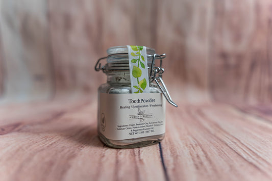 A Wright Creation Healing Tooth Powder in a reusable glass jar with eco-friendly packaging, formulated with bentonite clay, menthol crystals, and natural ingredients to heal, remineralize, and freshen teeth, ideal for sensitive oral care routines.