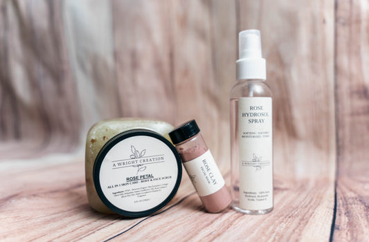 A Wright Creation Rose Petal Trio Bundle featuring a rose body scrub, rose clay facial mask, and rose hydrosol spray, crafted with natural ingredients to soften, soothe, and moisturize sensitive skin, ideal for eczema, psoriasis, and dry skin relief.